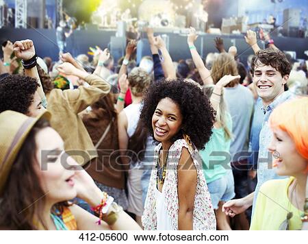 Fans dancing and cheering at music festival View Large Photo Image Stock Image - Fans dancing and cheering at music festival. Fotosearch