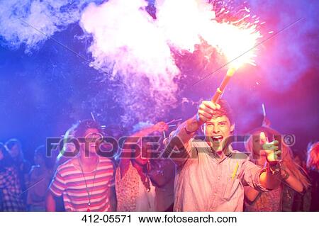 Fans with fireworks at music festival View Large Photo Image Stock Image - Fans with fireworks at music festival. Fotosearch