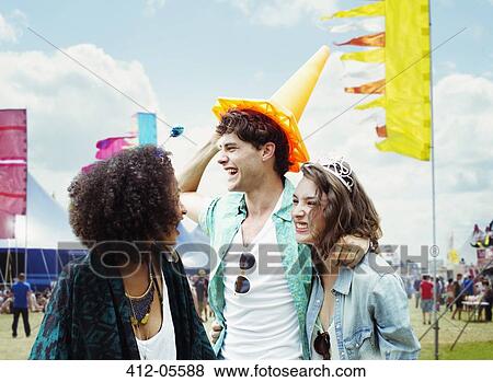 Stock Photo - Friends at music festival. Fotosearch