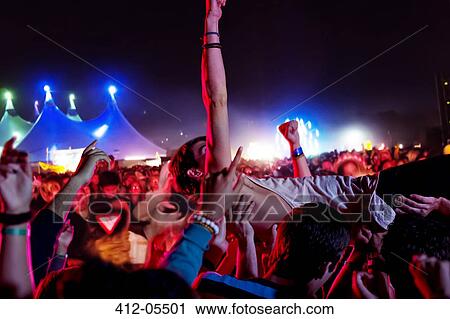 Man crowd surfing at music festival View Large Photo Image Stock Image - Man crowd surfing at music festival. Fotosearch