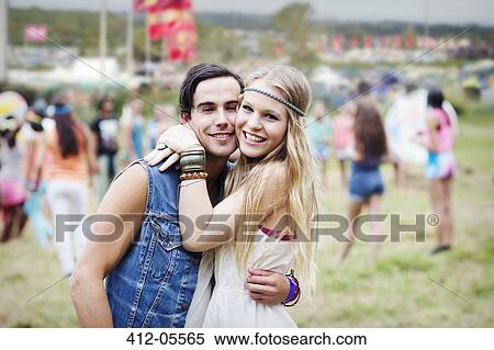 Portrait of couple hugging at music festival View Large Photo Image Stock Photography - Portrait of couple hugging at music festival. Fotosearch