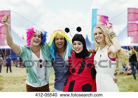 Portrait of friends in costumes at music festival View Large Photo Image Stock Image - Portrait of friends in costumes at music festival. Fotosearch