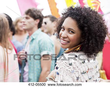 Portrait of smiling woman at music festival View Large Photo Image Stock Image - Portrait of smiling woman at music festival. Fotosearch