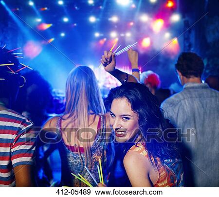 Woman with glow sticks at music festival View Large Photo Image Stock Photo - Woman with glow sticks at music festival. Fotosearch