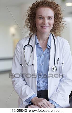 Doctor smiling in hospital View Large Photo Image Stock Image - Doctor smiling in hospital. Fotosearch