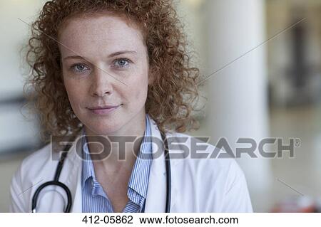 Doctor smiling in hospital View Large Photo Image Stock Image - Doctor smiling in hospital. Fotosearch