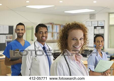 Doctors and nurse smiling in hospital View Large Photo Image Stock Image - Doctors and nurse smiling in hospital. Fotosearch