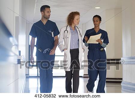 Hospital staff talking in hallway View Large Photo Image Stock Image - Hospital staff talking in hallway. Fotosearch