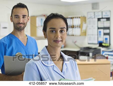 Nurses standing in hospital hallway View Large Photo Image Stock Photo - Nurses standing in hospital hallway. Fotosearch