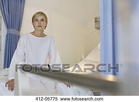 Patient sitting on hospital bed View Large Photo Image Stock Photography - Patient sitting on hospital bed. Fotosearch