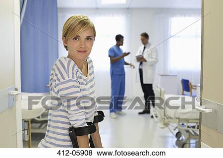 Patient using crutches in hospital room View Large Photo Image Stock Photo - Patient using crutches in hospital room. Fotosearch