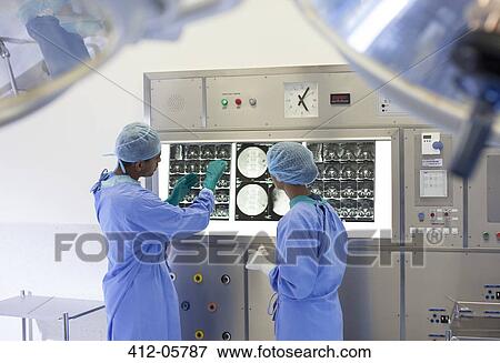 Surgeons examining x-rays in hospital View Large Photo Image Stock Photo - Surgeons examining x-rays in hospital. Fotosearch