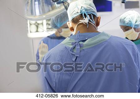 Stock Photograph - Surgeons working in operating room. Fotosearch