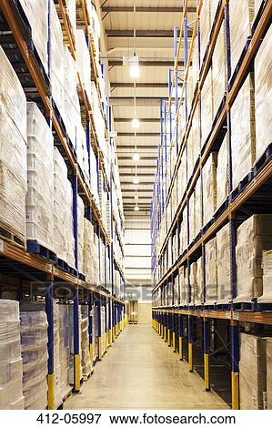 Aisle of boxes in warehouse View Large Photo Image Stock Photo - Aisle of boxes in warehouse. Fotosearch
