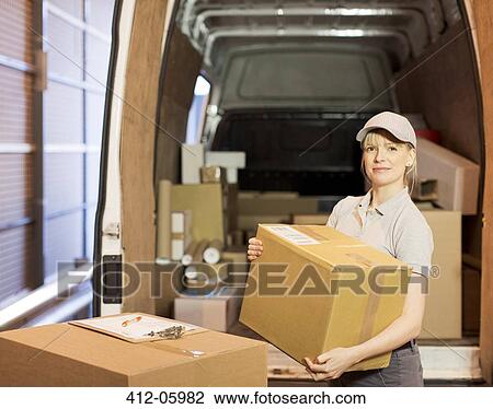 Delivery girl unloading boxes from van View Large Photo Image Stock Image - Delivery girl unloading boxes from van. Fotosearch