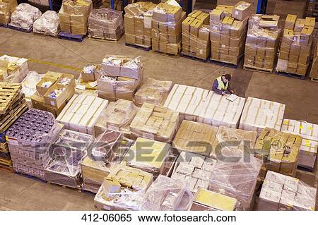 Worker using clipboard in warehouse View Large Photo Image Stock Photography - Worker using clipboard in warehouse. Fotosearch
