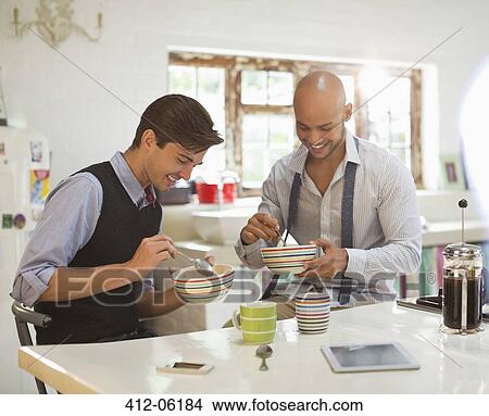 Businessmen having breakfast together View Large Photo Image Picture - Businessmen having breakfast together. Fotosearch