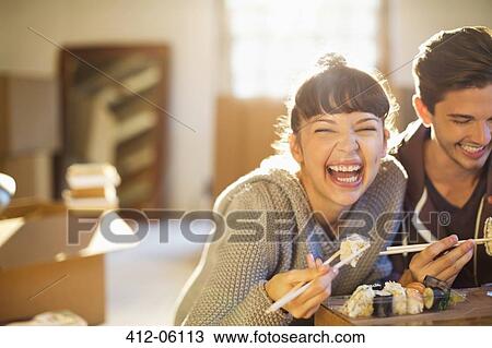 Couple eating sushi together View Large Photo Image Stock Image - Couple eating sushi together. Fotosearch