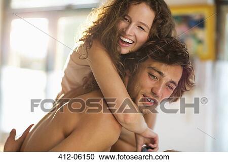 Couple hugging in bedroom View Large Photo Image Stock Image - Couple hugging in bedroom. Fotosearch