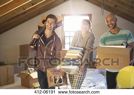 Friends unpacking boxes in attic View Large Photo Image Stock Image - Friends unpacking boxes in attic. Fotosearch
