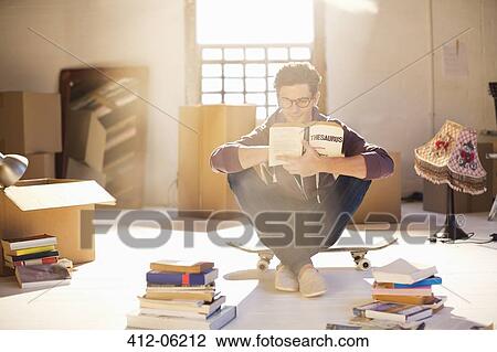 Man reading in new home View Large Photo Image Stock Image - Man reading in new home. Fotosearch