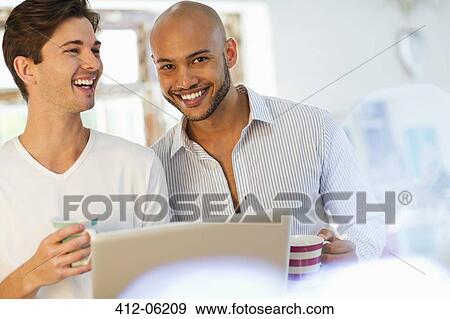 Men having coffee together View Large Photo Image Stock Photo - Men having coffee together. Fotosearch
