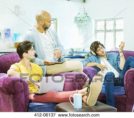 Men watching friend play air guitar View Large Photo Image Stock Photo - Men watching friend play air guitar. Fotosearch