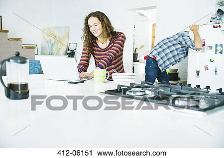 Woman using laptop at breakfast View Large Photo Image Stock Image - Woman using laptop at breakfast. Fotosearch
