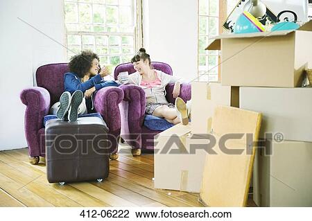 Women having coffee together in new home View Large Photo Image Stock Image - Women having coffee together in new home. Fotosearch