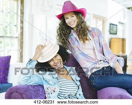 Women wearing colorful cowboy hats View Large Photo Image Stock Image - Women wearing colorful cowboy hats. Fotosearch