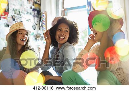 Women wearing hats in bedroom View Large Photo Image Stock Photograph - Women wearing hats in bedroom. Fotosearch