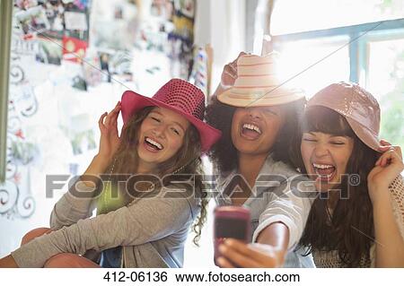 Women wearing hats in bedroom View Large Photo Image Stock Photograph - Women wearing hats in bedroom. Fotosearch