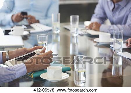 Business people sitting in meeting View Large Photo Image Stock Photo - Business people sitting in meeting. Fotosearch