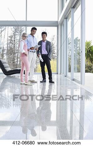 Business people smiling in office View Large Photo Image Stock Image - Business people smiling in office. Fotosearch
