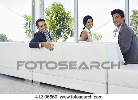Business people smiling on sofa View Large Photo Image Stock Image - Business people smiling on sofa. Fotosearch