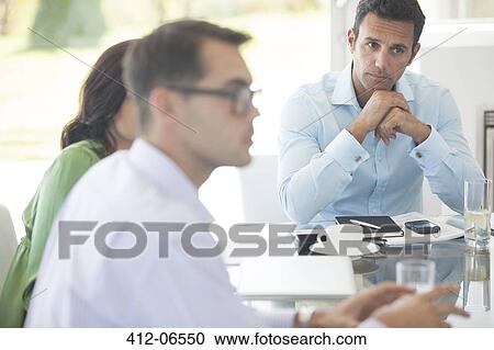 Business people talking in meeting View Large Photo Image Stock Image - Business people talking in meeting. Fotosearch