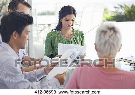 Business people talking in meeting View Large Photo Image Stock Photo - Business people talking in meeting. Fotosearch