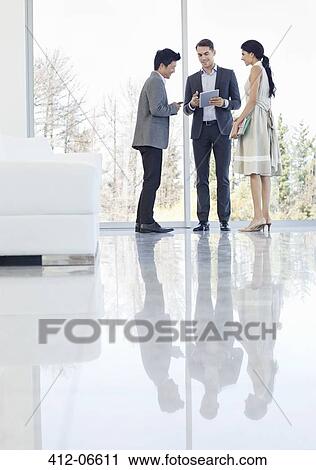 Business people talking in office View Large Photo Image Stock Image - Business people talking in office. Fotosearch