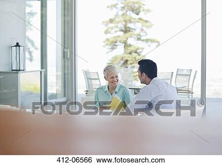 Stock Photograph - Business people talking in office. Fotosearch
