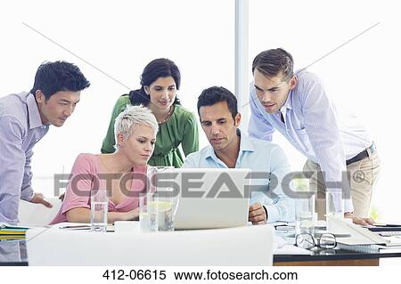 Business people using laptop in meeting View Large Photo Image Stock Photography - Business people using laptop in meeting. Fotosearch