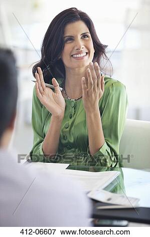 Stock Photo - Businesswoman clapping in meeting. Fotosearch