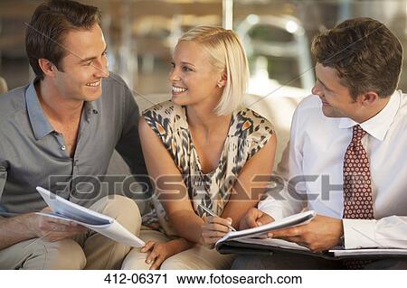 Business people talking on sofa View Large Photo Image Stock Image - Business people talking on sofa. Fotosearch