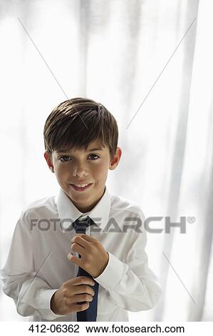 Smiling boy wearing shirt and tie View Large Photo Image Stock Image - Smiling boy wearing shirt and tie. Fotosearch