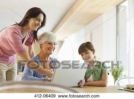 Three generations of women using tablet computer View Large Photo Image Stock Photo - Three generations of women using tablet computer. Fotosearch