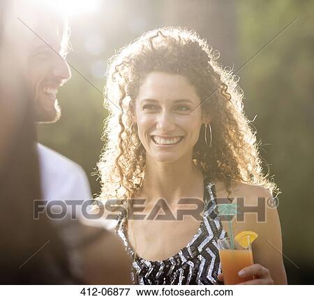 Couple having drinks outdoors View Large Photo Image Stock Photo - Couple having drinks outdoors. Fotosearch