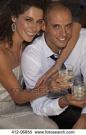 Couple hugging at party View Large Photo Image Stock Photography - Couple hugging at party. Fotosearch