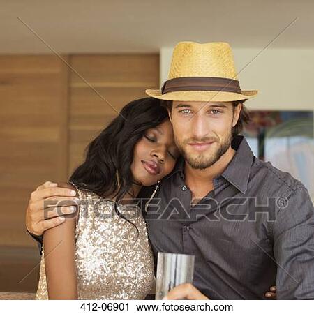 Couple hugging indoors View Large Photo Image Stock Image - Couple hugging indoors. Fotosearch