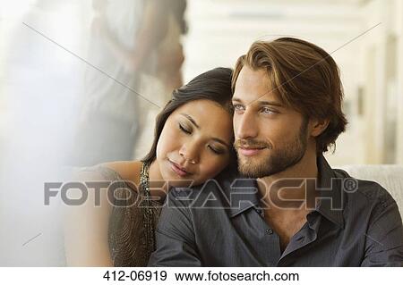 Couple hugging indoors View Large Photo Image Stock Photo - Couple hugging indoors. Fotosearch