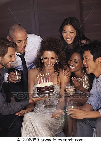 Stock Photo - Friends celebrating birthday. Fotosearch