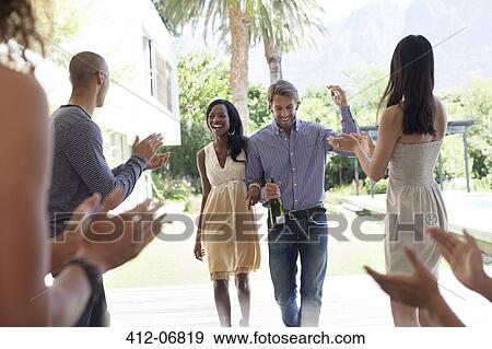 Friends cheering for couple View Large Photo Image Stock Photo - Friends cheering for couple. Fotosearch